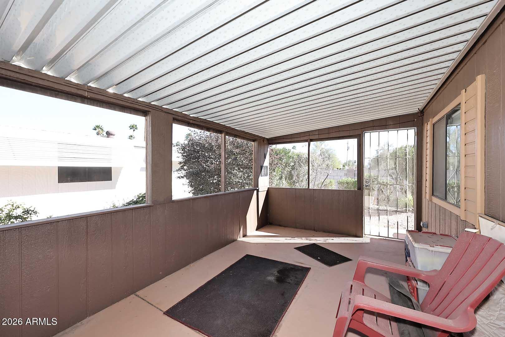 9302 East Broadway Road, Unit 76 Mesa, AZ 85208 - Photo 28 of 38 a laptop computer sitting on a desk next to a window
