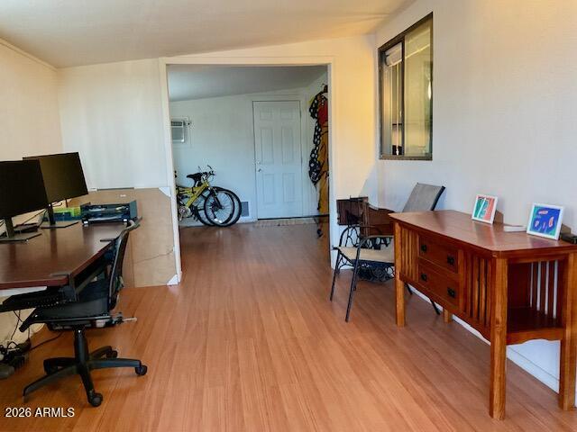 9302 East Broadway Road, Unit 76 Mesa, AZ 85208 - Photo 3 of 38 a view of a workspace with furniture and a bedroom