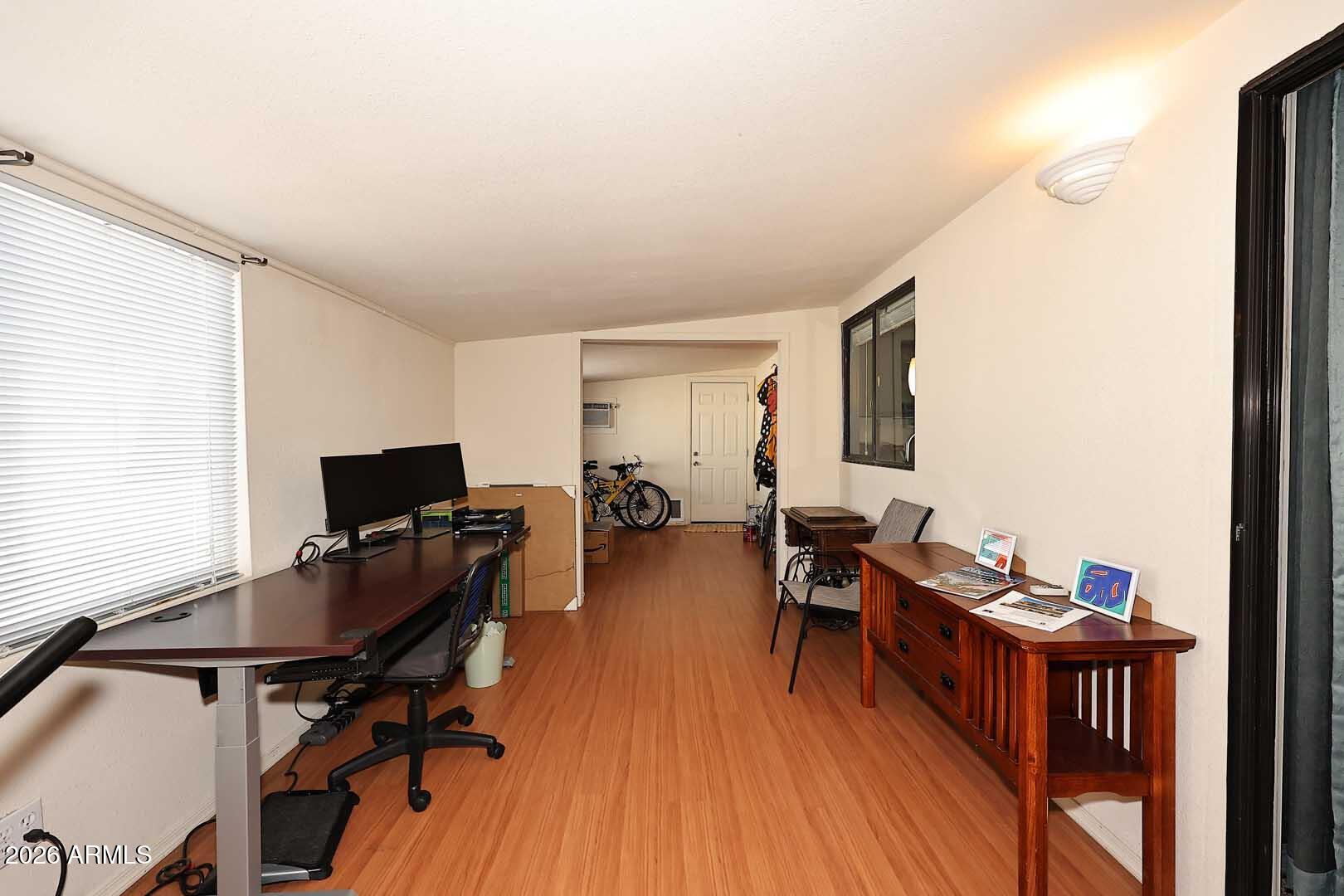 9302 East Broadway Road, Unit 76 Mesa, AZ 85208 - Photo 31 of 38 a view of a workspace with furniture and a window