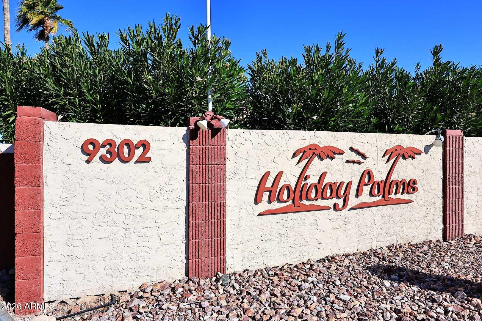 9302 East Broadway Road, Unit 76 Mesa, AZ 85208 - Photo 33 of 38 a sign board with buildings in the background