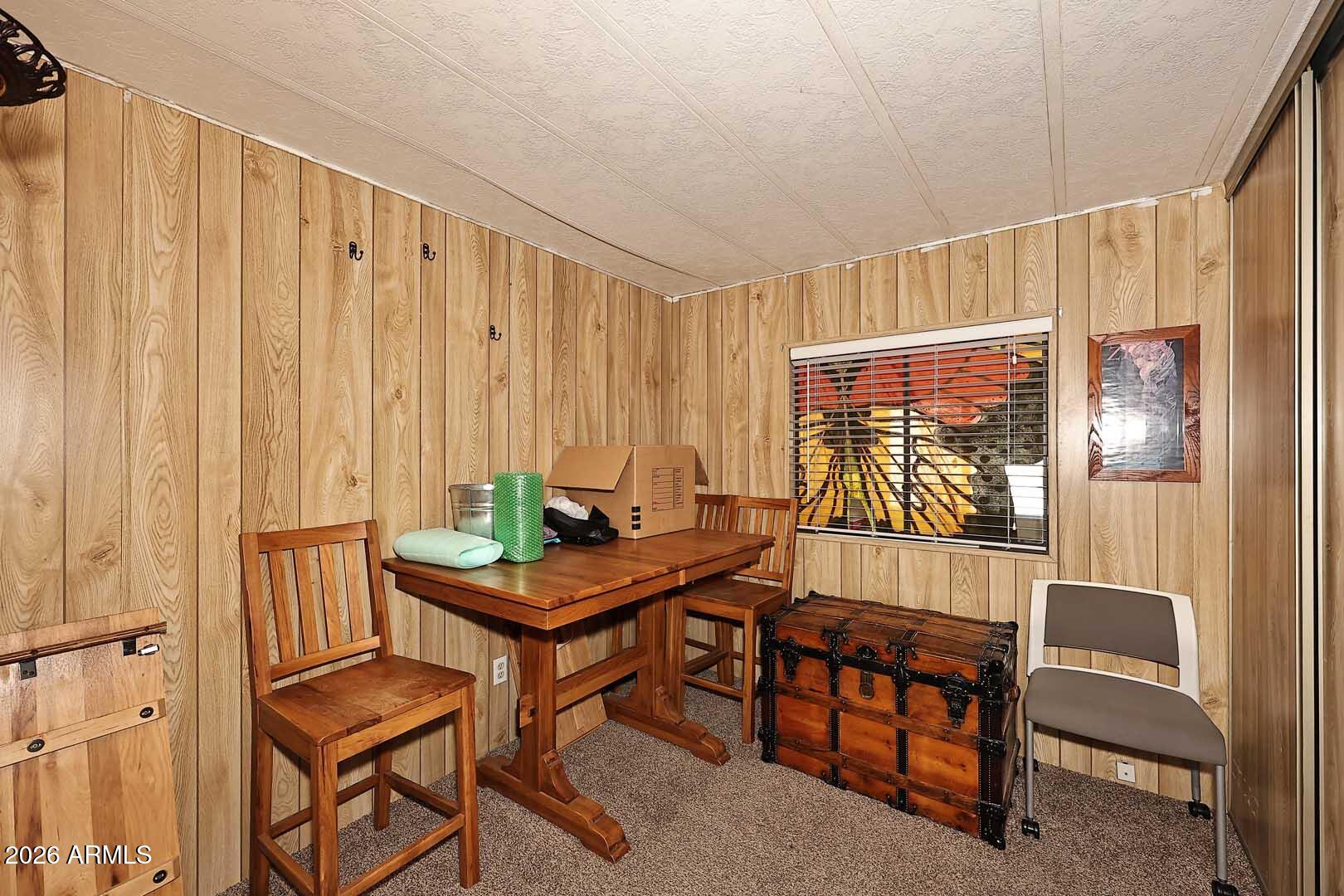 9302 East Broadway Road, Unit 76 Mesa, AZ 85208 - Photo 7 of 38 a dining room with furniture and a window