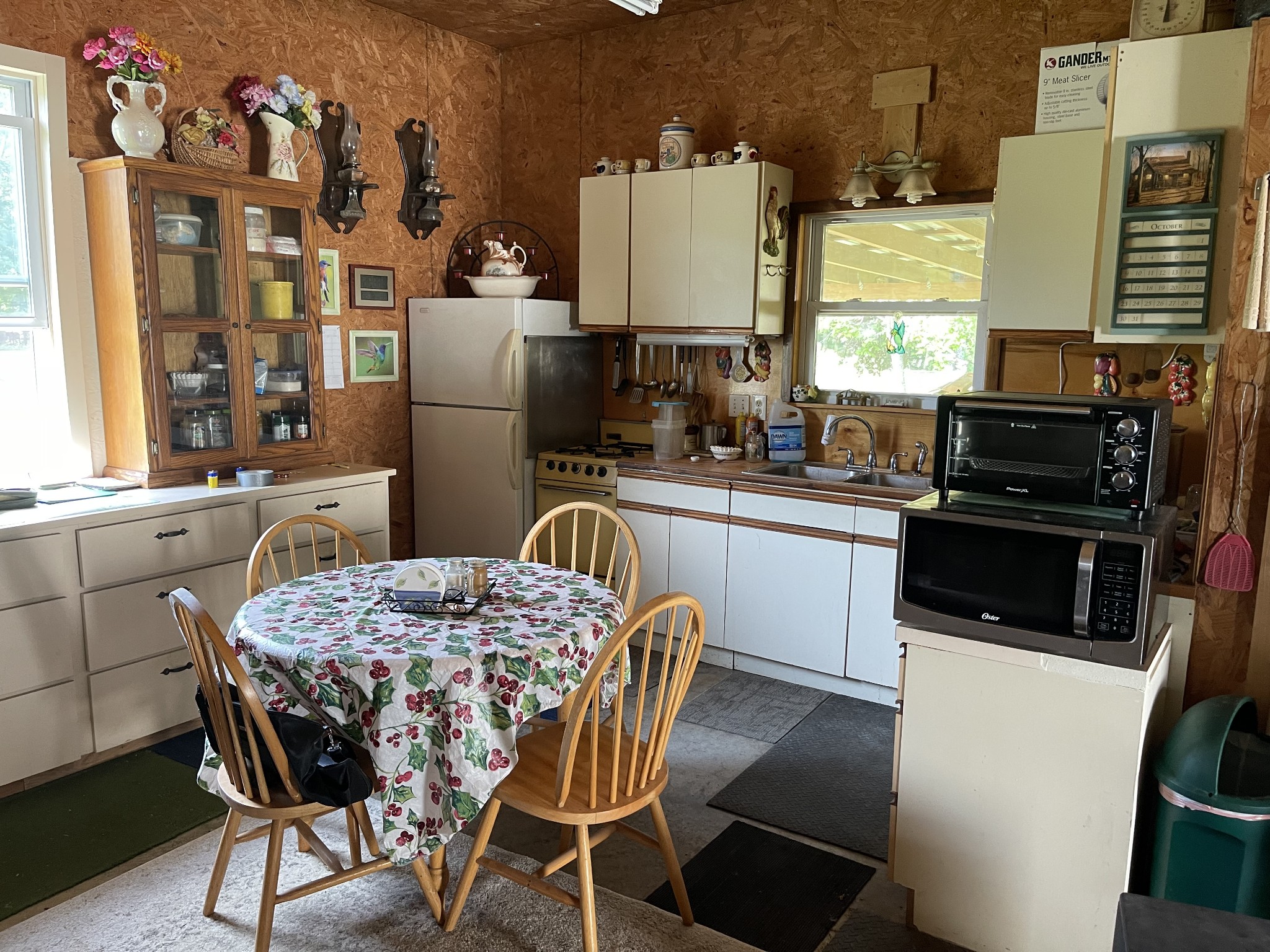 2330 Dog Branch Road Prospect, TN 38477 - Photo 28 of 31 a kitchen with stainless steel appliances granite countertop a stove a refrigerator a sink dishwasher with a dining table and chairs