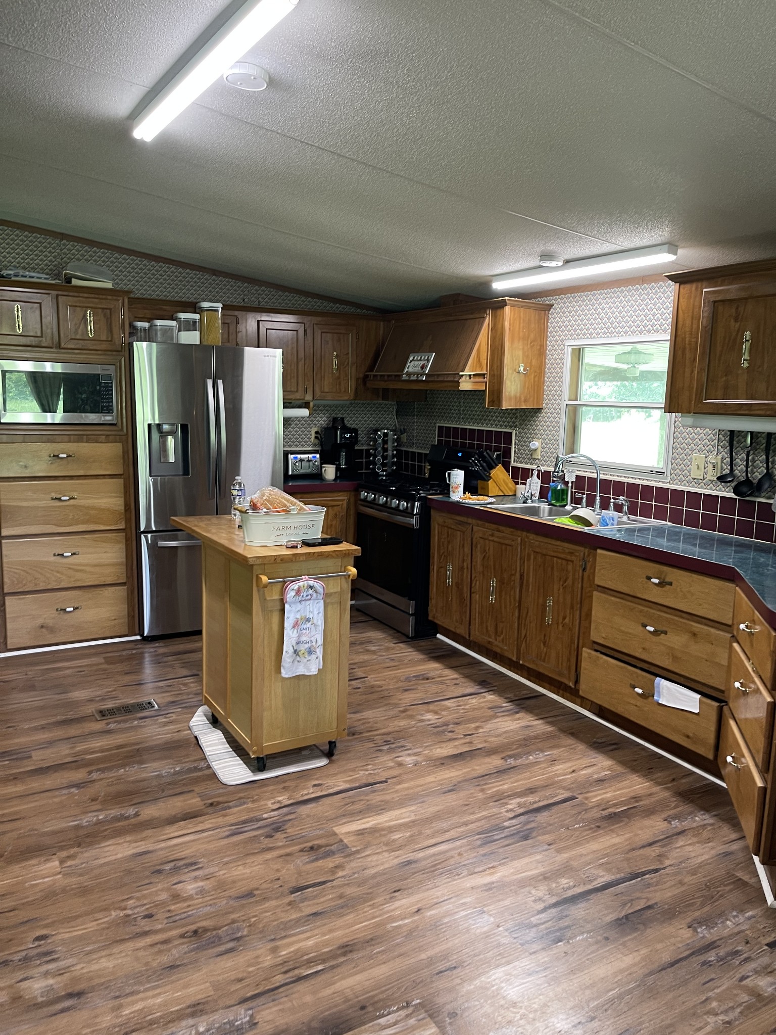 2330 Dog Branch Road Prospect, TN 38477 - Photo 4 of 31 a kitchen with stainless steel appliances granite countertop a stove and a sink
