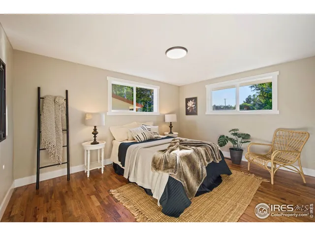 a bedroom with a bed and a chair