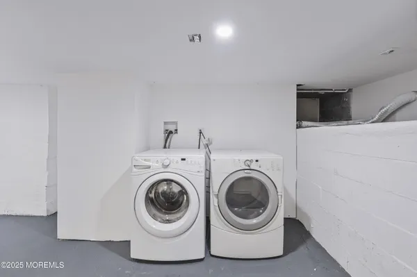 a picture of a room with a white wall and white cabinet
