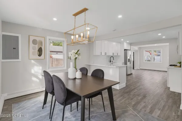 a kitchen with stainless steel appliances a refrigerator sink and cabinets