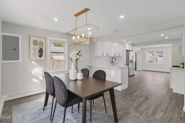 a kitchen with stainless steel appliances a refrigerator sink and cabinets