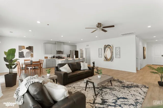 a view of kitchen with cabinets table and chairs