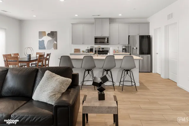 a large kitchen with a table and chairs