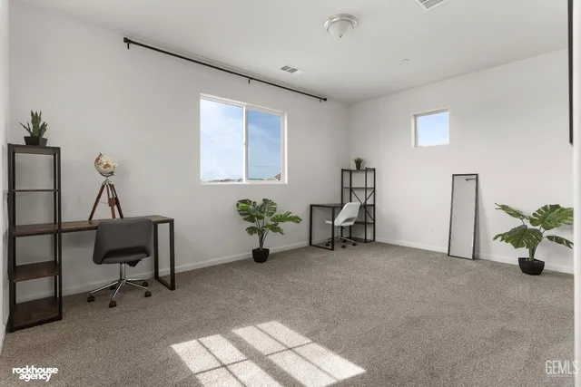 a bedroom with a bed and a mirror