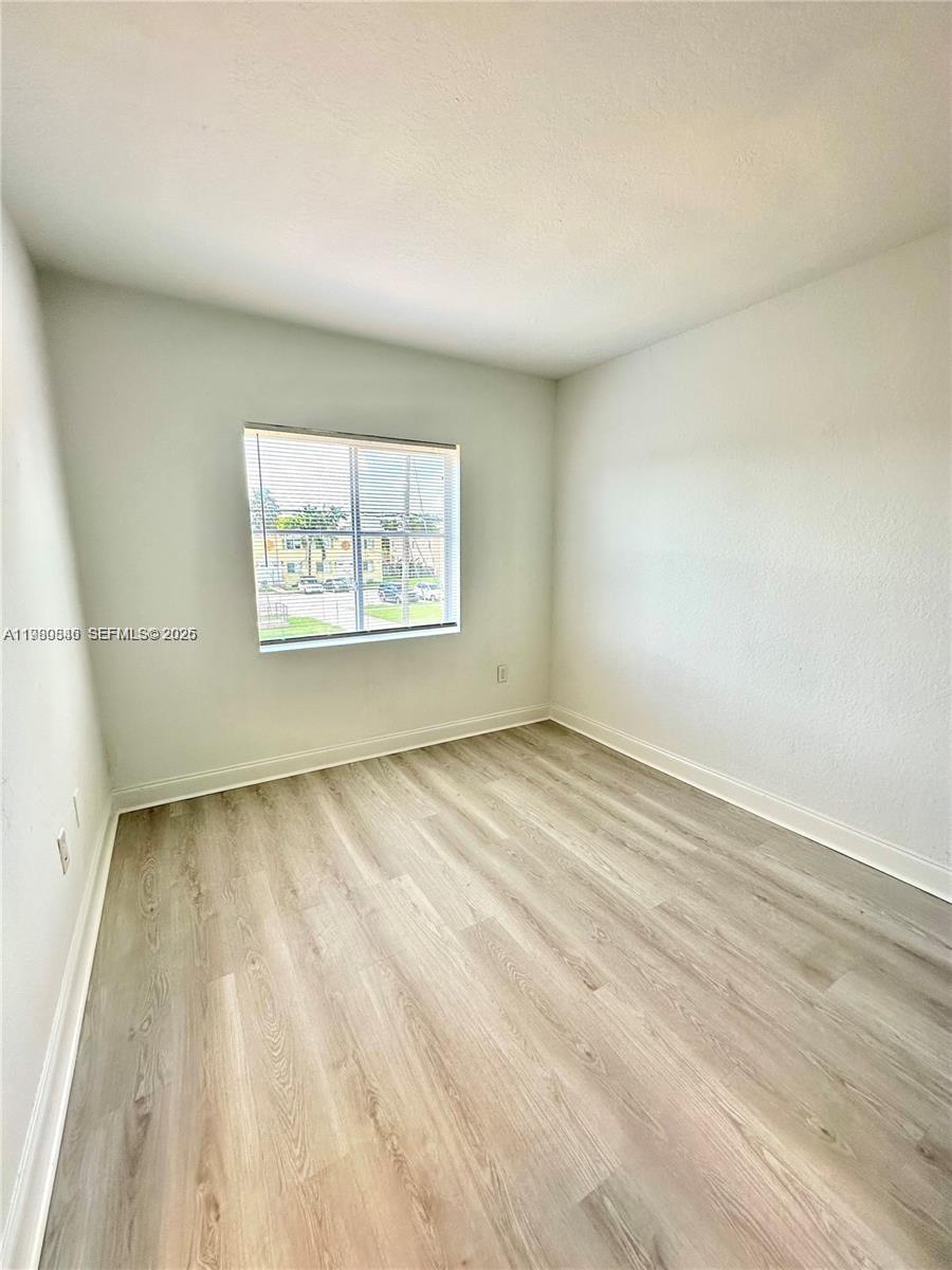 434 Northwest 85th Street Road, Unit 434 Miami, FL 33150 - Photo 26 of 31 an empty room with a window