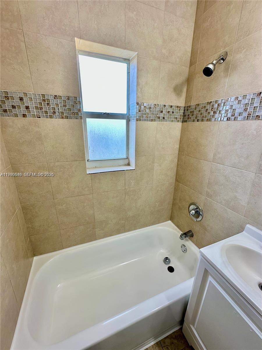 434 Northwest 85th Street Road, Unit 434 Miami, FL 33150 - Photo 27 of 31 a bathroom with a bathtub and shower