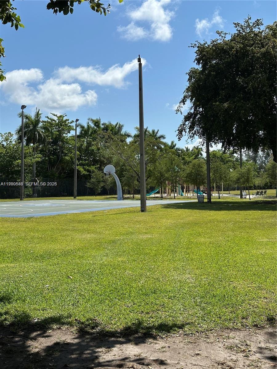 434 Northwest 85th Street Road, Unit 434 Miami, FL 33150 - Photo 29 of 31 a view of a swimming pool with an outdoor space and seating area