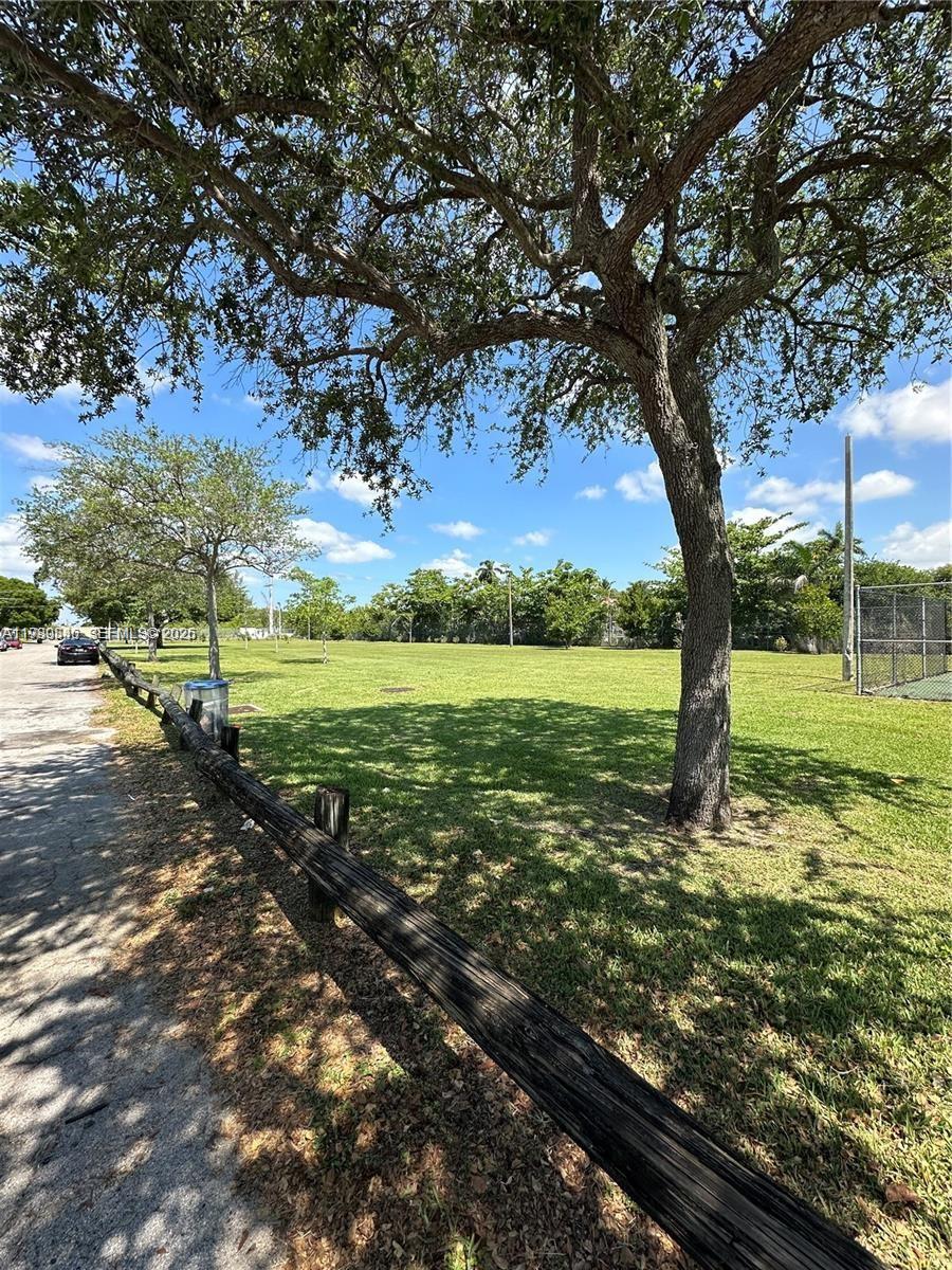 434 Northwest 85th Street Road, Unit 434 Miami, FL 33150 - Photo 31 of 31 a large tree is standing in between the yard