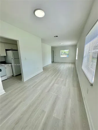 a view of an empty room and window