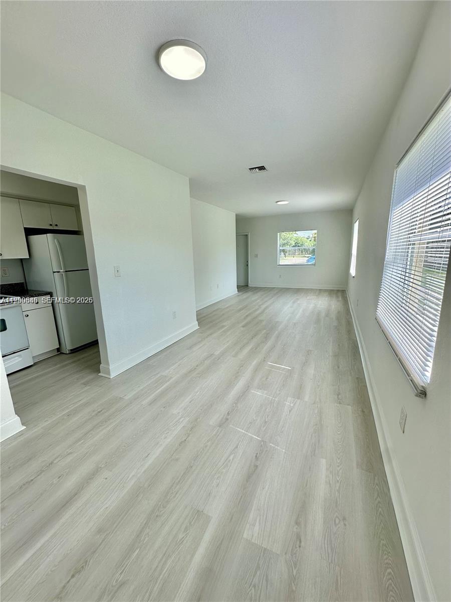 434 Northwest 85th Street Road, Unit 434 Miami, FL 33150 - Photo 5 of 31 a view of an empty room and window