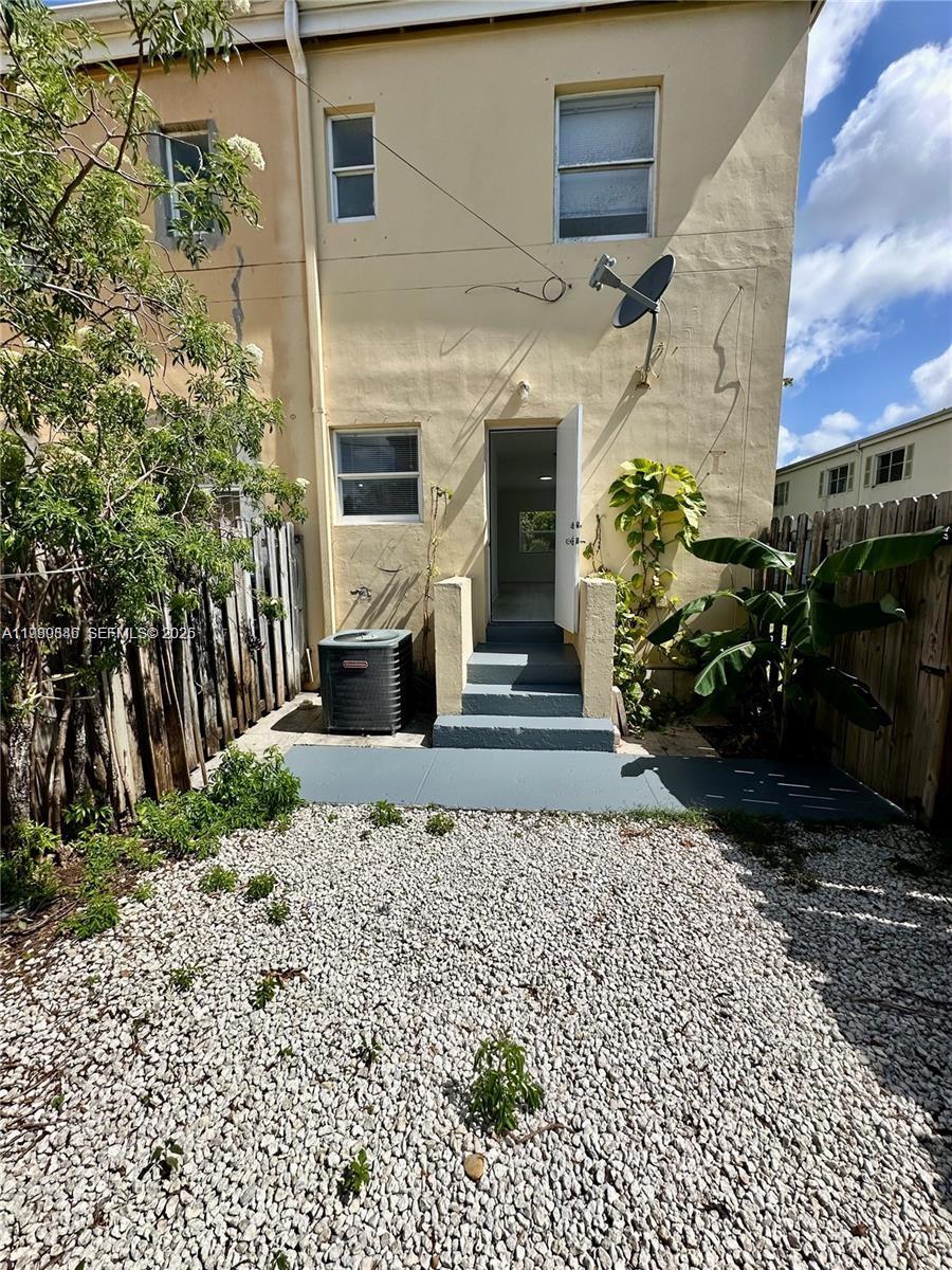 434 Northwest 85th Street Road, Unit 434 Miami, FL 33150 - Photo 10 of 31 a front view of a house with a yard