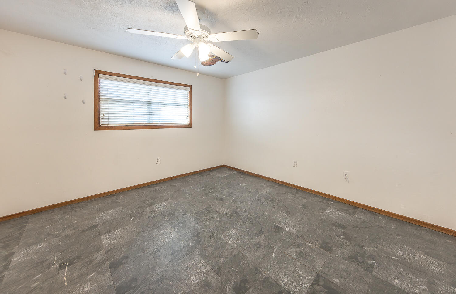 505 Owen Street Lubbock, TX 79403 - Photo 15 of 32 an empty room with a window