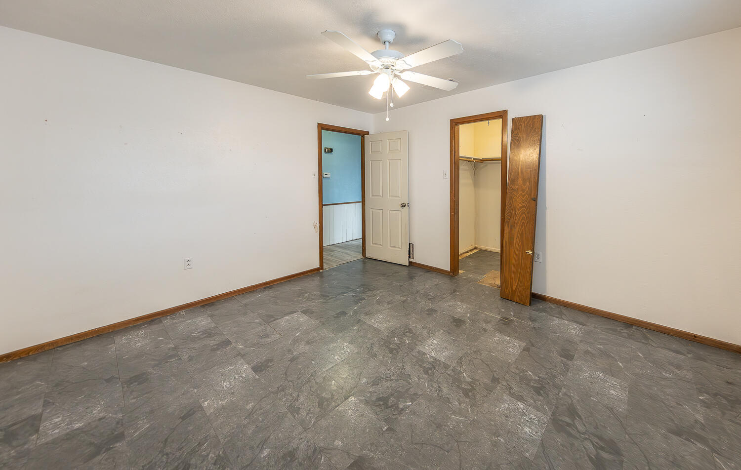 505 Owen Street Lubbock, TX 79403 - Photo 16 of 32 an empty room with a ceiling fan and a window