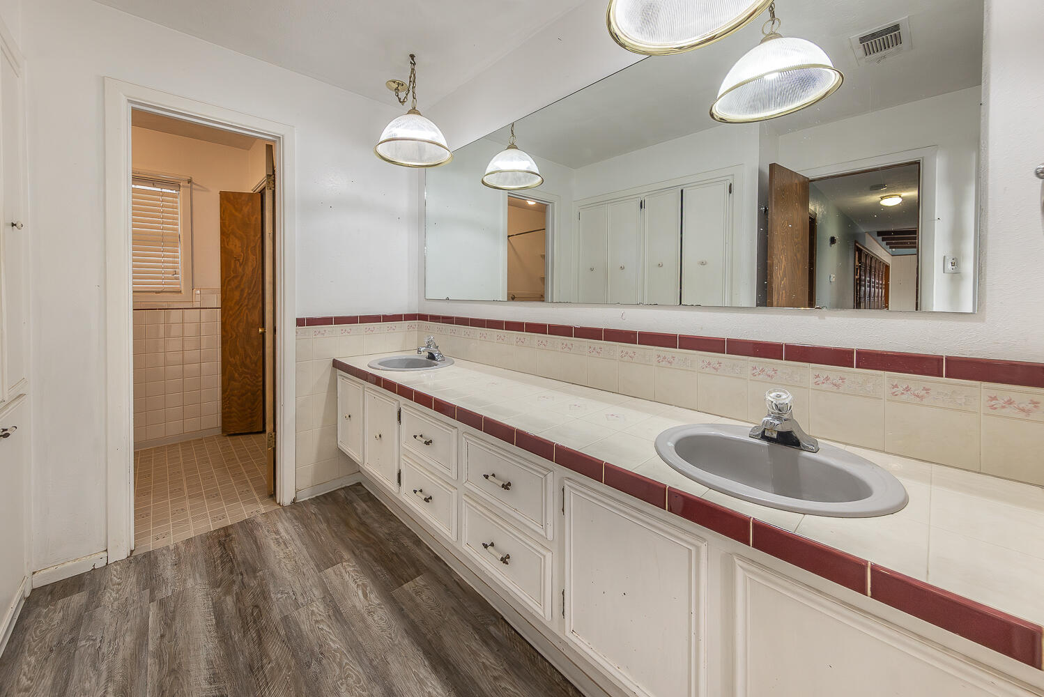 505 Owen Street Lubbock, TX 79403 - Photo 21 of 32 a bathroom with a sink and a mirror