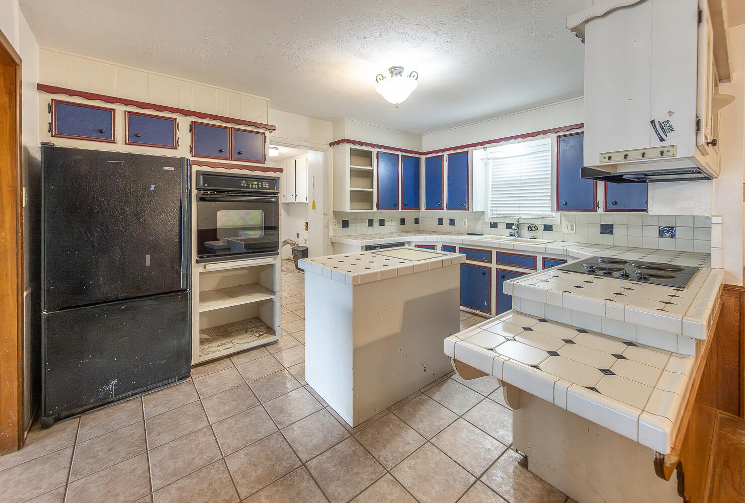 505 Owen Street Lubbock, TX 79403 - Photo 9 of 32 a kitchen with stainless steel appliances a stove a refrigerator and a sink