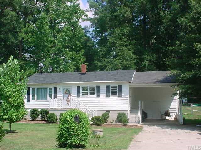 5501 Meadowbrook Road Raleigh, NC 27603 - Photo 1 of 9 a house that has tree in front of it