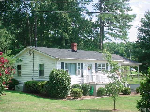 5501 Meadowbrook Road Raleigh, NC 27603 - Photo 2 of 9 a front view of a house with a yard