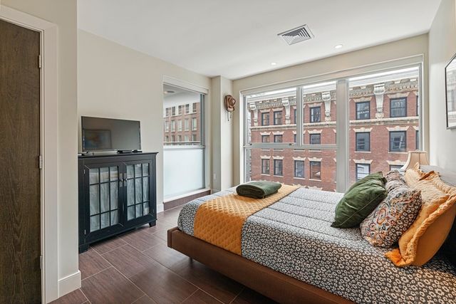a bedroom with a bed furniture and a window