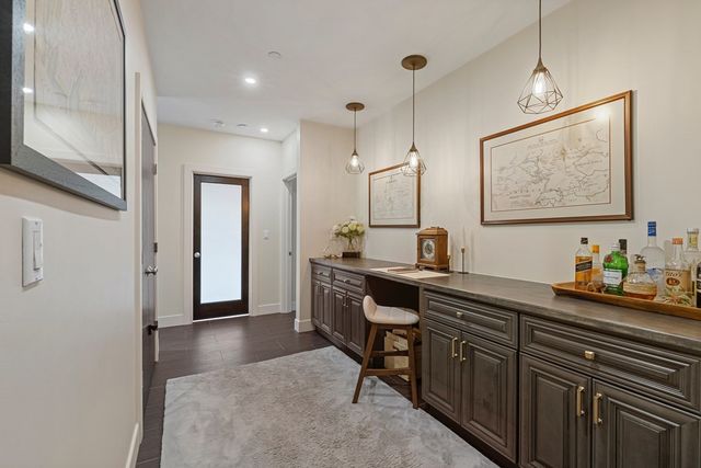 a view of a center island table and chairs