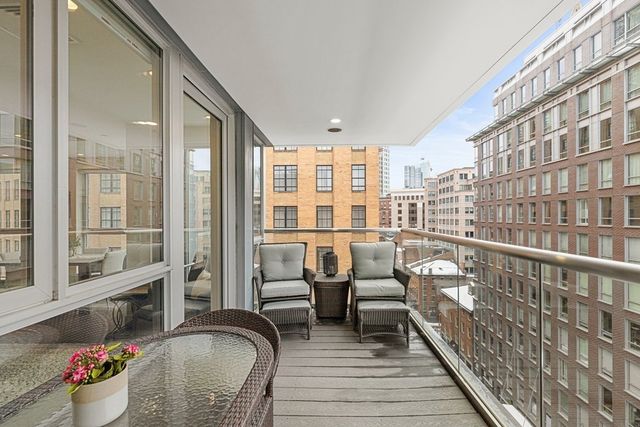 a balcony view with a seating space