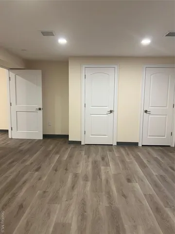 a view of a livingroom with wooden floor