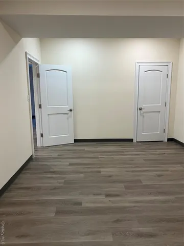 a view of a livingroom with wooden floor