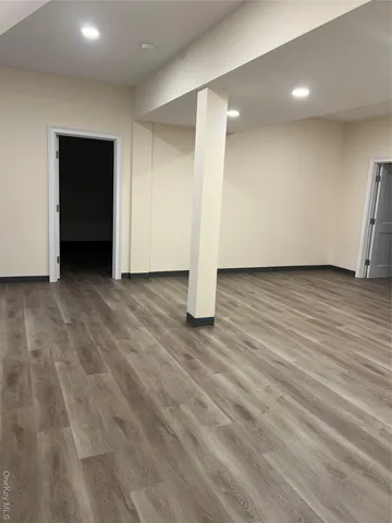 a view of a livingroom with wooden floor