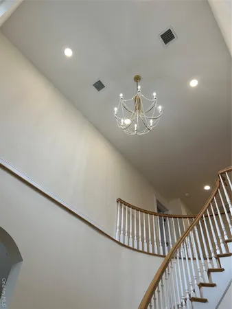 a view of a livingroom with stairs