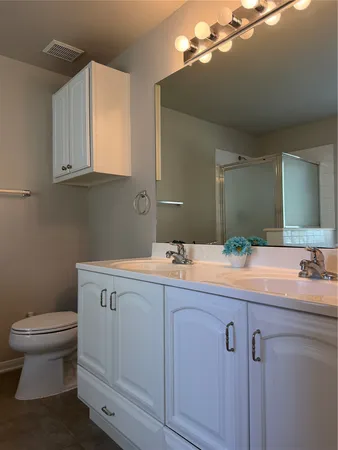 a spacious bathroom with a bathtub and shower