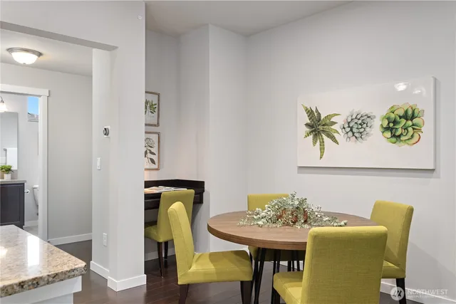 a bathroom with a sink a toilet a mirror and shower