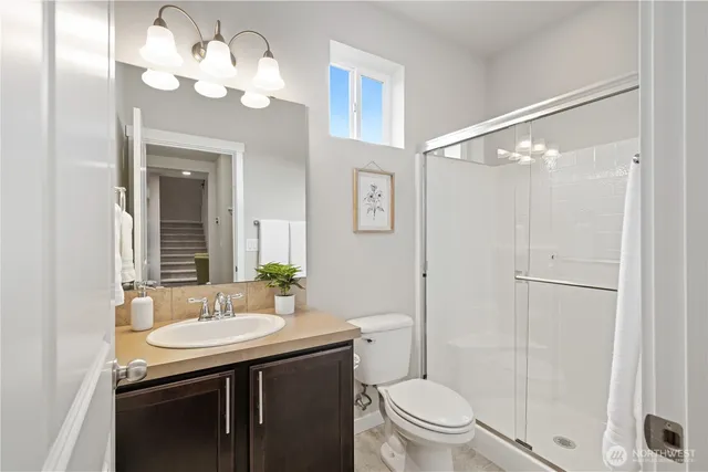 a workspace with wooden floor and a window