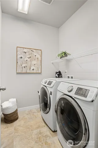 a bathroom with a double vanity sink mirror and double