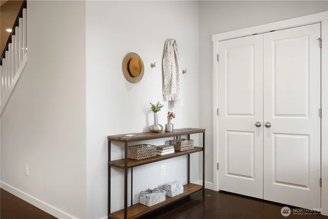 a view of an entryway with wooden floor