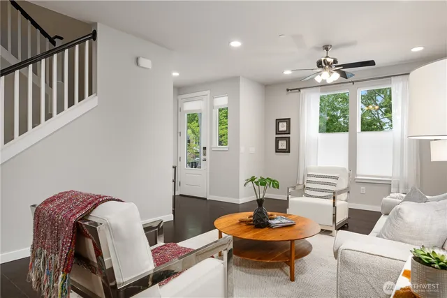 a kitchen with stainless steel appliances kitchen island granite countertop a stove a sink a refrigerator and a refrigerator