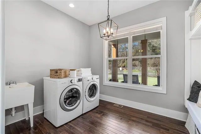 a view of a hallway with washer and dryer