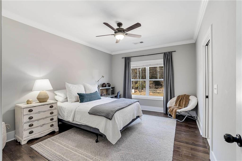 9245 Brumbelow Road Alpharetta, GA 30022 - Photo 27 of 50 a bedroom with a bed and window