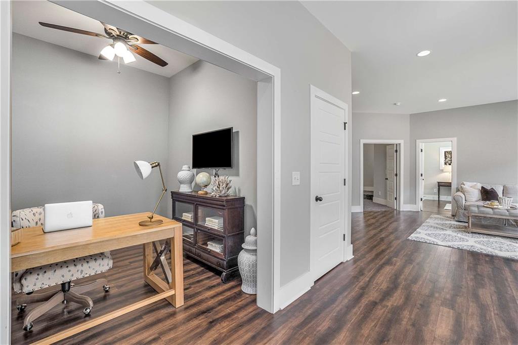 9245 Brumbelow Road Alpharetta, GA 30022 - Photo 37 of 50 a view of a workspace with furniture and wooden floor