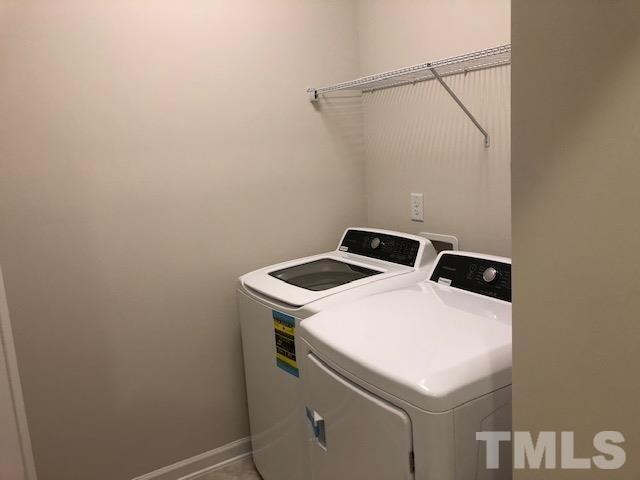 6033 Beale Loop Raleigh, NC 27616 - Photo 12 of 16 a utility room with dryer and washer