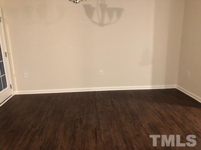 6033 Beale Loop Raleigh, NC 27616 - Photo 4 of 16 a view of a room with wooden floor