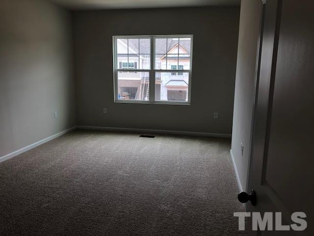 6033 Beale Loop Raleigh, NC 27616 - Photo 5 of 16 an empty room with a window