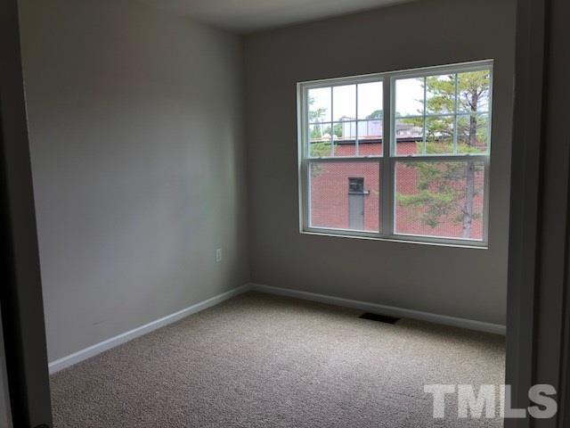 6033 Beale Loop Raleigh, NC 27616 - Photo 6 of 16 an empty room with a window