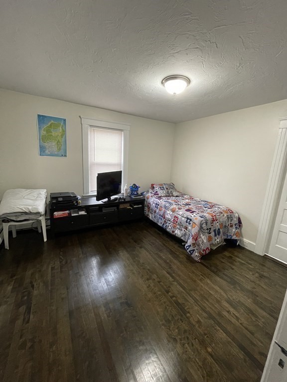 9 Thayer Street Worcester, MA 01603 - Photo 12 of 18 a bedroom with bed and a window