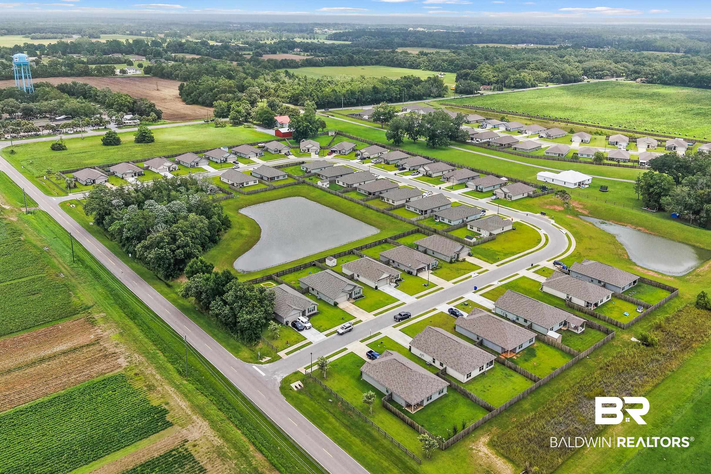 32030 Terranova Loop Lillian, AL 36549 - Photo 26 of 30 Aerial perspective showcasing a residential development with numerous single-story homes