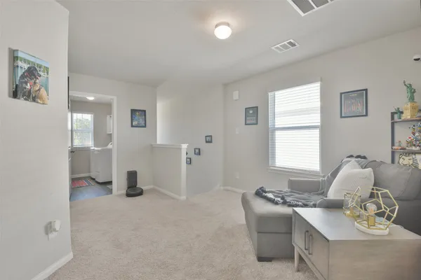 a living room with furniture and window